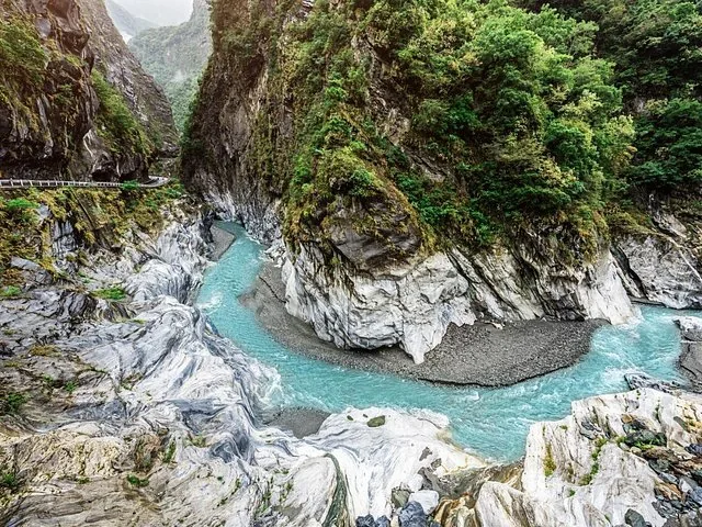 Scenic view of a turquoise river flowing through Taroko Gorge's marble canyon.